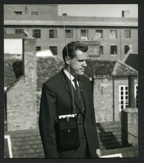Frank Bird posing with a new Pye portable radio