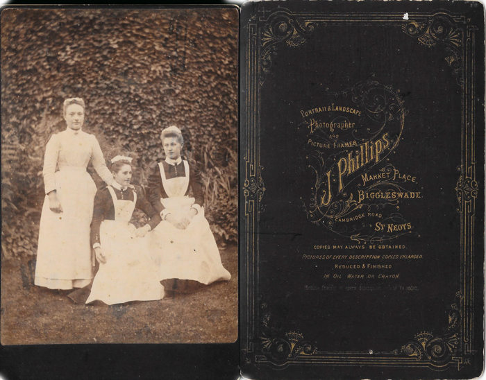 cabinet photograph (reproduced with the kind permission of Chris Haslop) showing a housekeeper and two maids. The firm's Biggleswade address shown as 